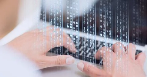 Binary coding data processing against mid section of person using laptop Foto stock