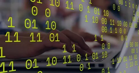 Binary coding data processing against close up of person hands using a laptop 写真素材