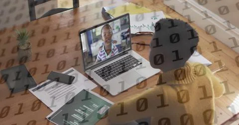 Binary coding data processing against african american teacher having a Stock Photos