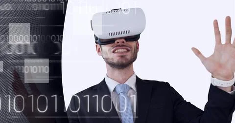 Binary coding data processing over businessman wearing vr headset against Stock Photos