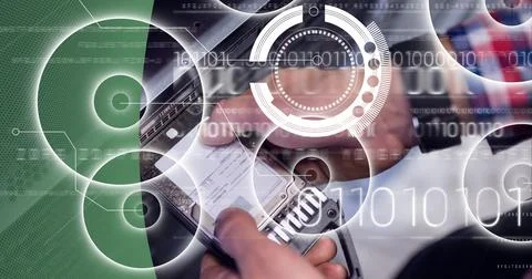 Binary coding data processing over man working in server room against green Stock Photos