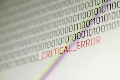 Binary computer code with inscription Critical error on computer screen Foto stock