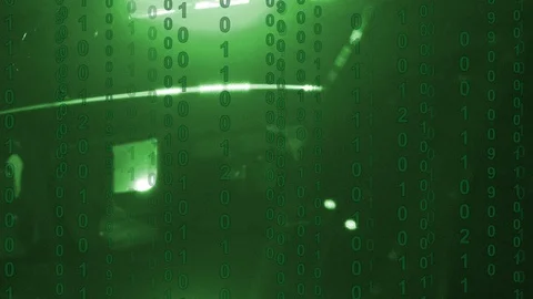 Binary computer code scrolling over the flashing lights of a police car Stock Footage 102692174