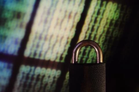 Binary computer language matrix blurred be hide an iron Padlock. sign of comp Foto stock