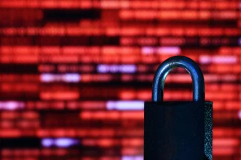 Binary computer language red matrix blurred be hide an iron Padlock. sign of Foto stock