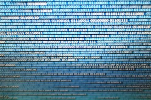 Binary data on computer monitor. multiple layers of codes streaming signifyin Foto stock