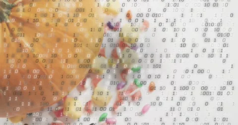 Binary digits drifting down over pumpkin and candies, starting at second frame Stock Footage 317772807
