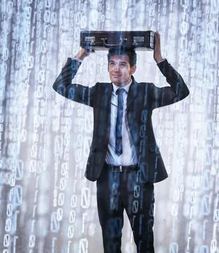 Binary downpour. Studio concept shot of a businessman being rained on by bina Foto stock