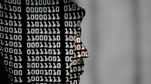 Binary language projected onto the profile of a hacker Stock-Footage 167683340