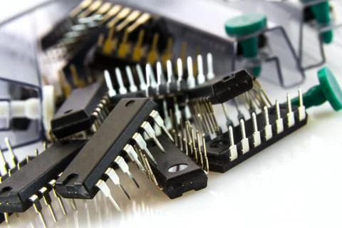 Binary logic ICs spilled out of bushings at low yellow flash Stock Photos