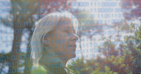 Binary overlay appearing over scene while woman standing lakeshore gazing for Video stock 315866078