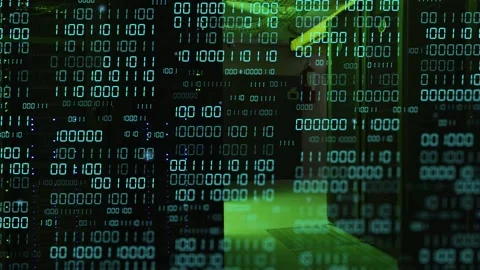 Binary overlay shifting, technician walking data corridor and pausing near rack Stock Footage 335465700
