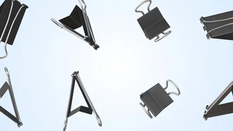 Binder Clips Falling on a Light Blue Background. Metal Binder Clips 3D. 4K Stock Footage 301955885