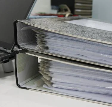 Binders with papers in office Stock Photos