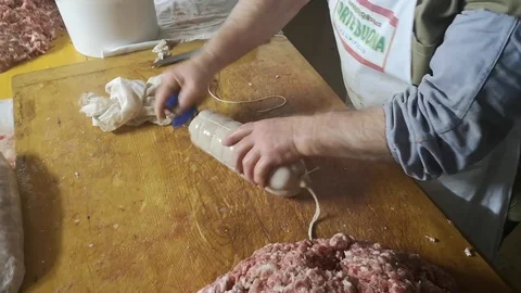Binding and processing of fresh salami from the butcher Stock Footage 101446779