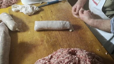 Binding and processing of fresh salami from the butcher Stock Footage 101446792