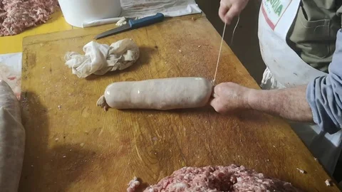Binding and processing of fresh salami from the butcher Stock Footage 101446793