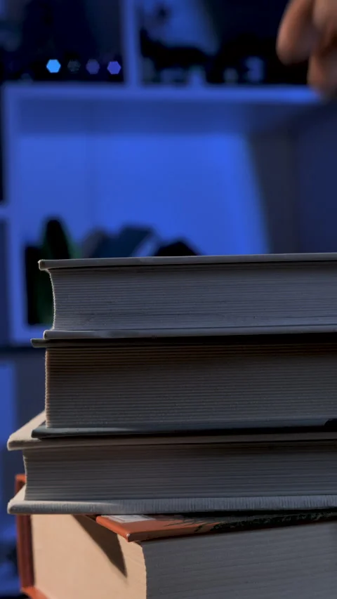 Binding hardback books on a wooden table Video stock 337057226