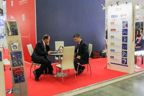 Binesmen with laptops at the table. Stock Photos