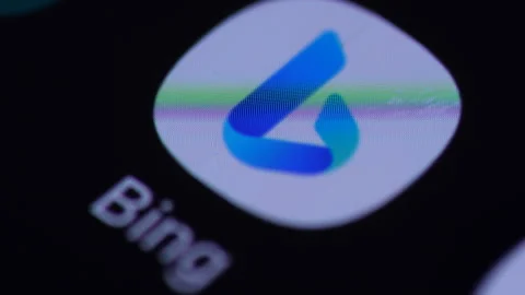 The Bing application is launched on the smartphone. Bing program logo icon .. Stock Footage 264011609