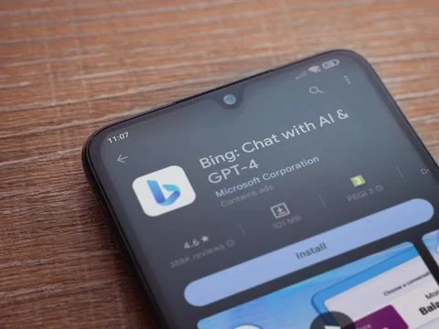 Bing Browser app play store page on smartphone on wooden background Stock Photos