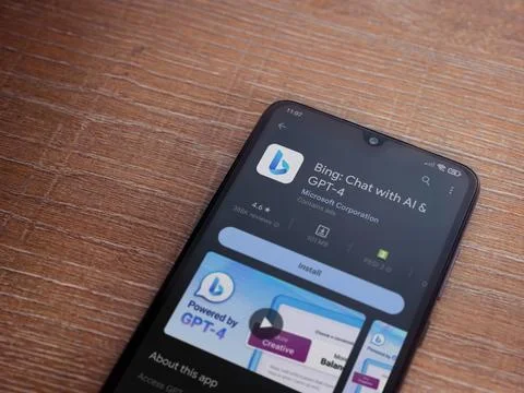 Bing Browser app play store page on smartphone on wooden background Stock Photos