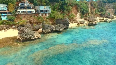 Bingin beach Bali Indonesea soft wave low tide relax rock coral riff point Stock Footage 106570804