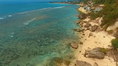 Bingin beach Bali Indonesea soft wave low tide relax rock coral riff point Stock Footage 106570899