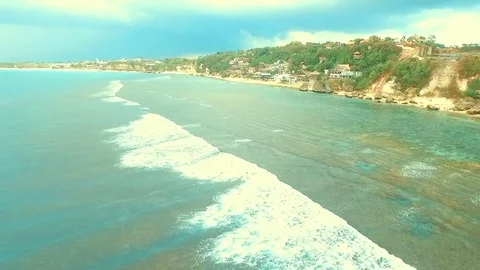 Bingin beach Bali Indonesea soft wave low tide relax rock coral riff point Stock Footage 106571979