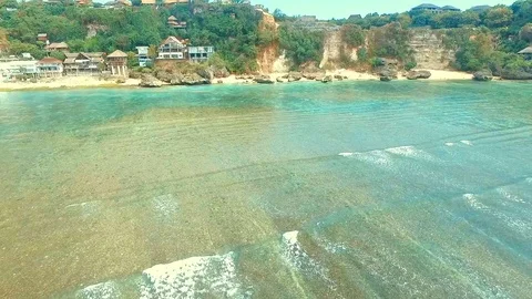 Bingin beach Bali Indonesea soft wave low tide relax rock coral riff point Stock Footage 106572090