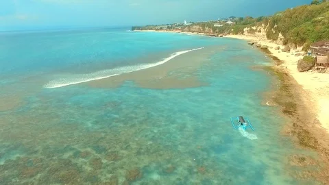 Bingin beach Bali Indonesea soft wave low tide relax rock coral riff point Stock Footage 106572422
