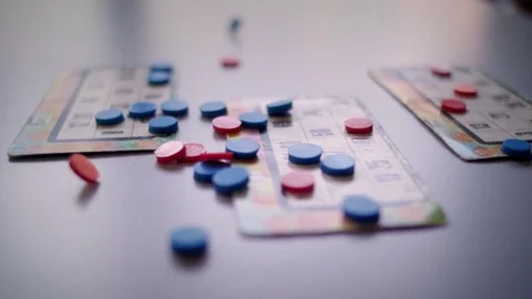 Bingo marks falling on the table Stock Footage 76557614