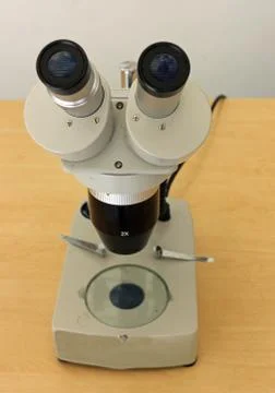 Binocular microscope on table Stock Photos
