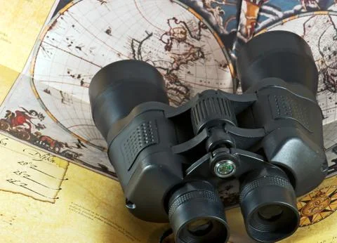 Binocular on old pirate map Stock Photos