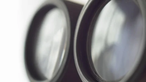 Binoculars Front Lens Reflecting Light and Clouds Close Up Stock Footage 127692455