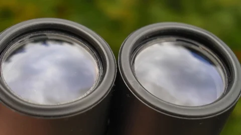 Binoculars Front Lens Reflecting Light and Clouds Close Up Stock Footage 127692497