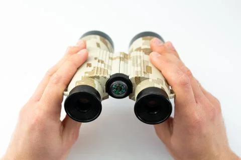 Binoculars in hands on a white background Stock Photos