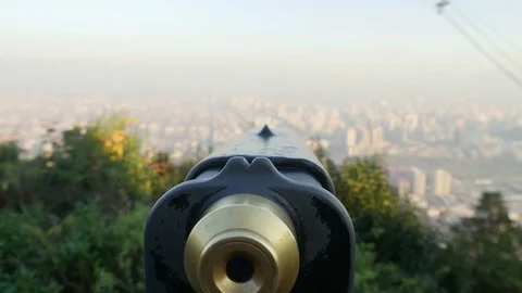 Binoculars on hill with city Stock Footage 77052071