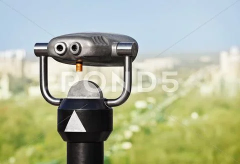 Binoculars to observe green city Stock Photos