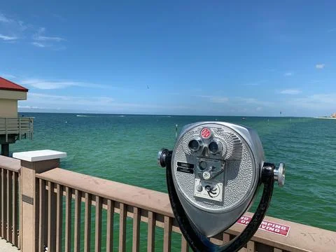 Binoculars overlooking the blue ocean Stock Photos