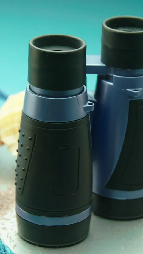 Binoculars Rotating in Summer Adventure Setup Stock Footage 313637126