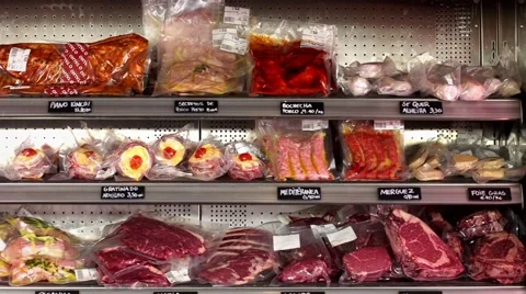 Bio food, Different sort of meats in a storage fridge display Stock Footage 50527399