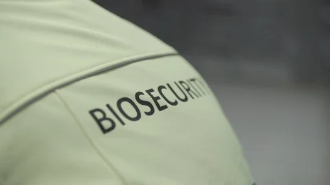 Bio Security sign on the back of a shirt Stock Footage 104837752