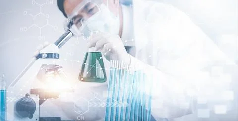 Biochemical research scientist working with microscope for coronavirus, labor Stock Photos