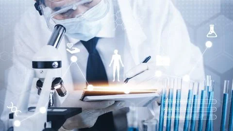 Biochemical research scientist working with a microscope for the virus,Doctor Stock Photos