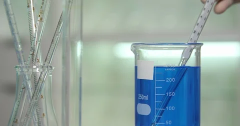 Biochemist Put Thermometer in Test Liquid Bottle Checking Temperature Laboratory Stock Footage 88015920