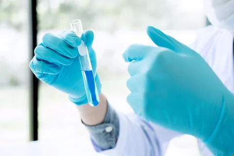 Biochemistry laboratory research, Chemist is analyzing sample in laboratory.. Stock Photos