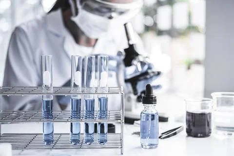 Biochemistry laboratory research, Chemist is analyzing sample in laboratory.. Stock Photos