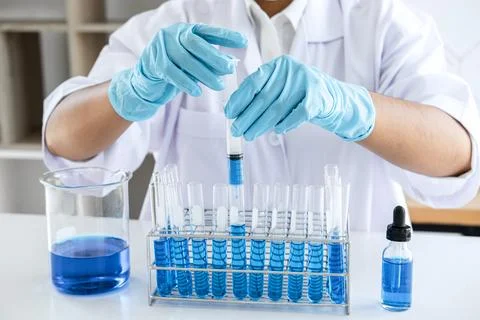 Biochemistry laboratory research, Chemist is analyzing sample in laboratory.. Stock Photos