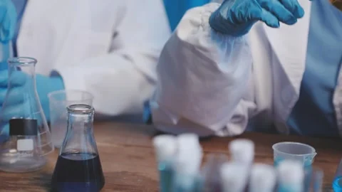 Biochemistry, scientist pipetting a sample into a test tube during an exper.. Stock Footage 290059861